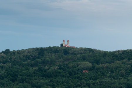 Village church on hill against gloomy sky, Saint Anthony church on Topuz hill near Derventaの写真素材