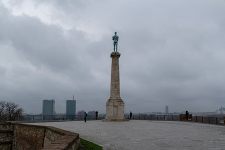 Victor statue at Belgrade park Kalemegdan during overcast day, famous medieval landmarkのeditorial素材