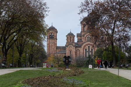 Monument to children victims of NATO aggression in Tasmajdan park in Belgrade, Saint Mark orthodox church in backgroundのeditorial素材