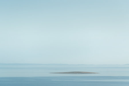 Small island surrounded with sea, deserted island