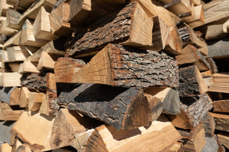 Pile of split wood close up, firewood for winter