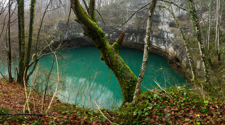 Lake called Bobijasko oko near Sanski Most, a hole filled with clear turquoise water on slopes of Grmec mountainの写真素材