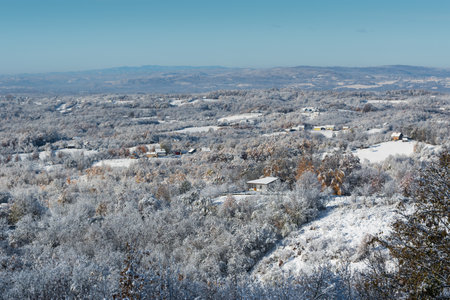 Village covered with snow blanket, wintry landscapeの写真素材