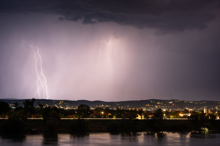 Beautiful lightning during thunderstorm at night, over hills near croatian city of Slavonski Brodの写真素材