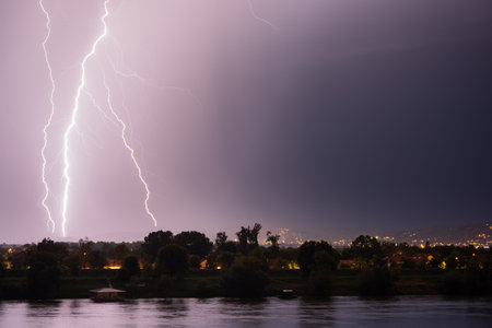 Beautiful lightning during thunderstorm at night, over hills near croatian city of Slavonski Brod