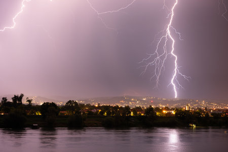Beautiful lightning during thunderstorm at night, over hills near croatian city of Slavonski Brod