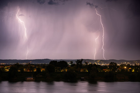 Beautiful lightning during thunderstorm at night, over hills near croatian city of Slavonski Brod