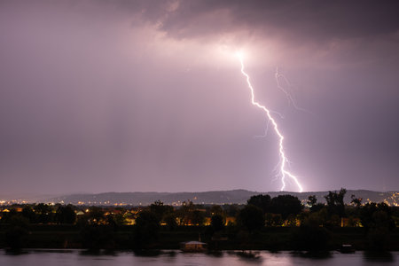 Beautiful lightning during thunderstorm at night, over hills near croatian city of Slavonski Brod
