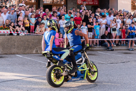 Moto stunt ride show on street, freestyle stunt show in front of audienceのeditorial素材