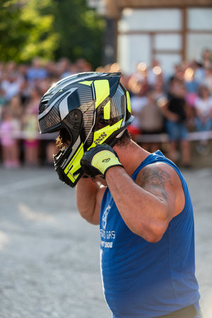 Stuntman Dejan Spoljar puts helmet on his head, close upのeditorial素材