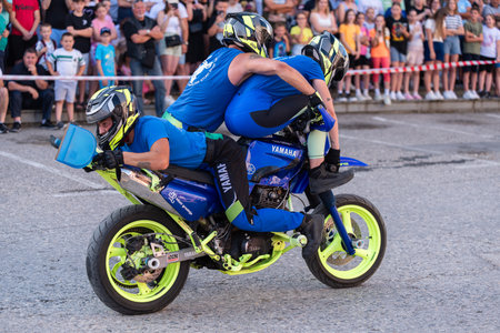 Moto stunt ride show on street, freestyle stunt show in front of audienceのeditorial素材