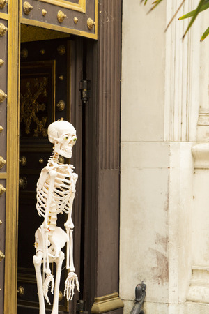 skeleton at the front door of the buildingの写真素材
