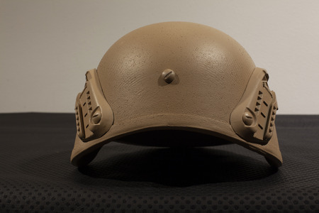 Beige military helmet on white backgroundの写真素材