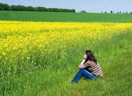 girl dreams admiring spring landscapeの写真素材