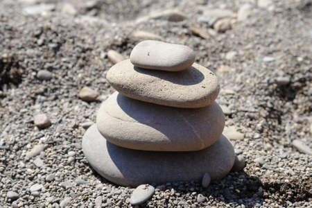 pyramid built from  stone on the beach                               