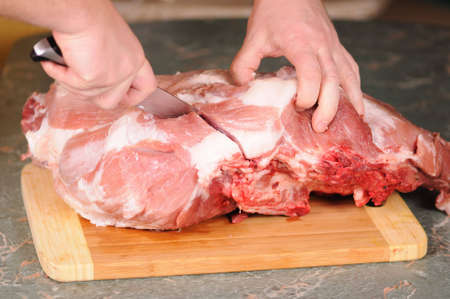 cutting of the big piece of meatの写真素材
