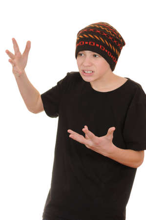The teenager in a black vest and a hat isolated on white backgroundの写真素材