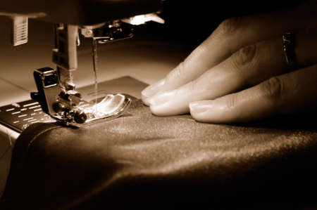 To sew a  material on the sewing machineの写真素材
