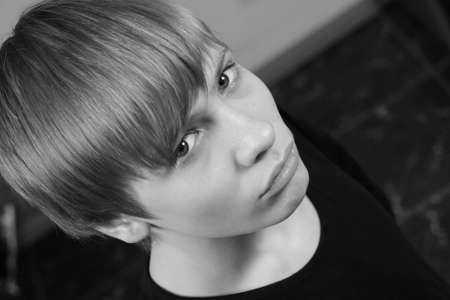 The teenager it is sad looks upwards                               の写真素材