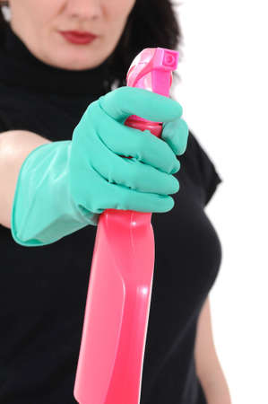 The woman in a cap and green gloves washes a windowの写真素材