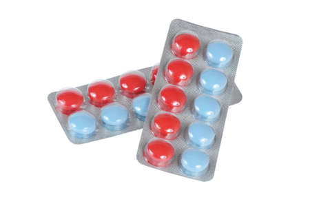 blue and red tablets isolated on white backgroundの写真素材