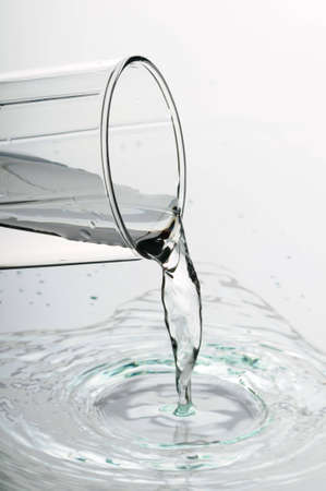 Pure transparent water  pour from a glass の写真素材