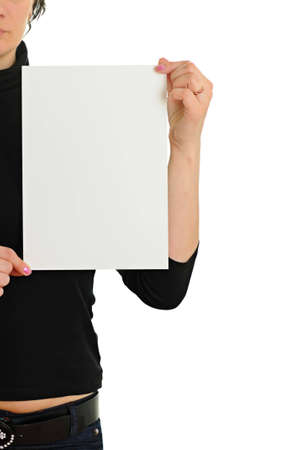 The woman holds empty sheet of paper isolated on white backgroundの写真素材