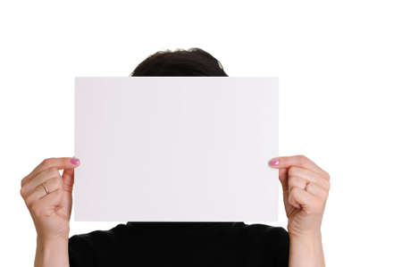 The woman holds empty sheet of paper isolated on white backgroundの写真素材