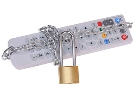 The television remote control is closed by the padlock with a chain isolated on white backgroundの写真素材