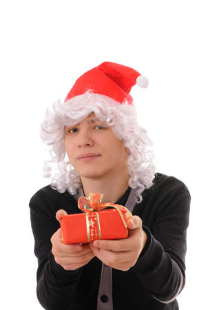 The teenager in a hat santa claus isolated on white backgroundの写真素材