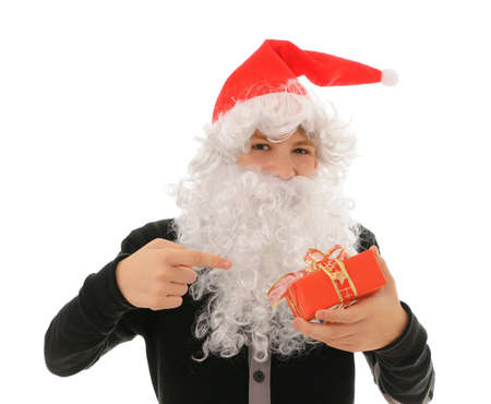 The teenager in a hat santa claus isolated on white backgroundの写真素材