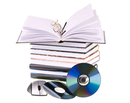 stack of books with pen glasses and a computer mouseの写真素材