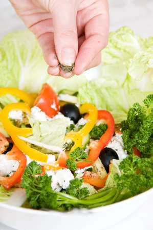 Preparation of vegetarian salad from fresh vegetablesの写真素材