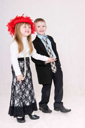 Smiling boy and girl hold each other's handの写真素材