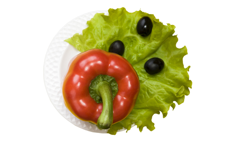 Bell pepper, olives, salad lettuce on white plate isolated on white backgroundの写真素材