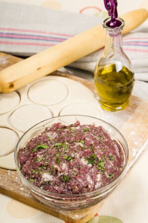 fresh raw dough and beef mince for cooking culinary productsの写真素材