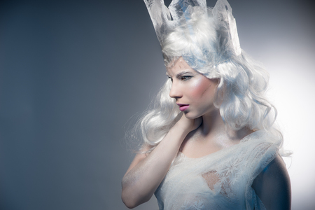 Winter Beauty Woman. Christmas Girl Makeup.Winter Queen with Snow and Ice crown.の写真素材