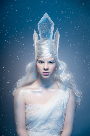 Winter Beauty Woman. Christmas Girl Makeup.Winter Queen with Snow and Ice crown.の写真素材