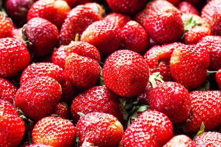 Fresh strawberry background. Ripe strawberry in close-up.の写真素材
