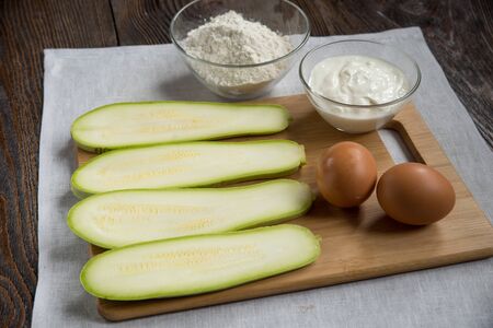 Zucchini pie. High angle view of ingredients in preparation for making zucchini pieの写真素材