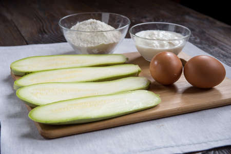 Zucchini pie. High angle view of ingredients in preparation for making zucchini pieの写真素材