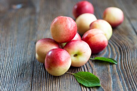 Nectarines composition close up on the wooden background.の写真素材