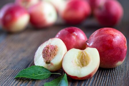 Nectarines composition close up on the wooden background.の写真素材