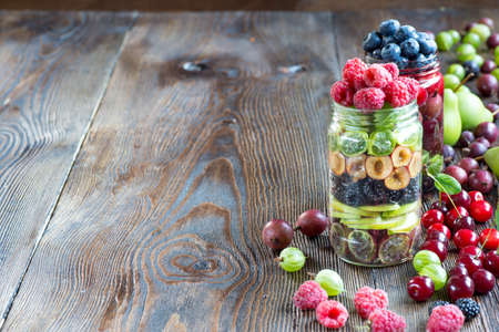 Healthy Homemade Mason Jar fruit Salad with different berries - Healthy food, Diet, Detox, Clean Eating or Vegetarian conceptの写真素材