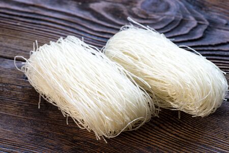Thai Dried Rice Noodles on wooden background