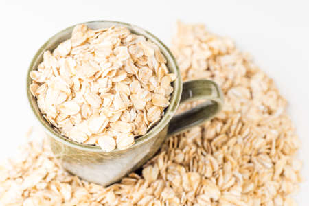 A healthy breakfast of oatmeal in a  rustic style cupの写真素材