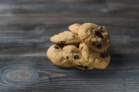 Chocolate chip cookies on rustic wooden table background. Sweet biscuits. Homemade pastry.の写真素材