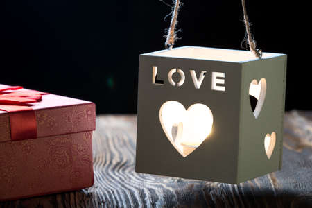 Gift box with candle and heart. Say i love you for valentine's day concept.の写真素材