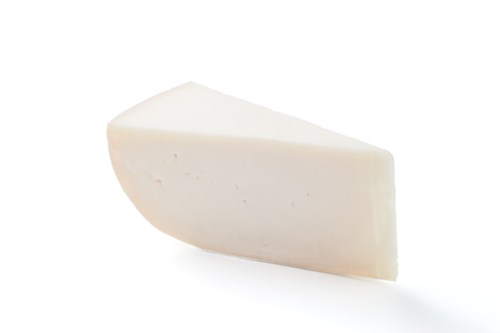 Piece of triangle goat cheese isolated on white backgroundの写真素材