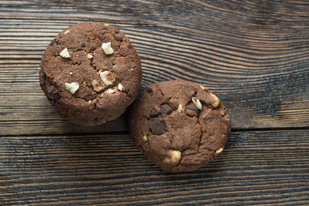 Homemade chocolate cookies on wooden table background. Food baking. Rustic background.の写真素材